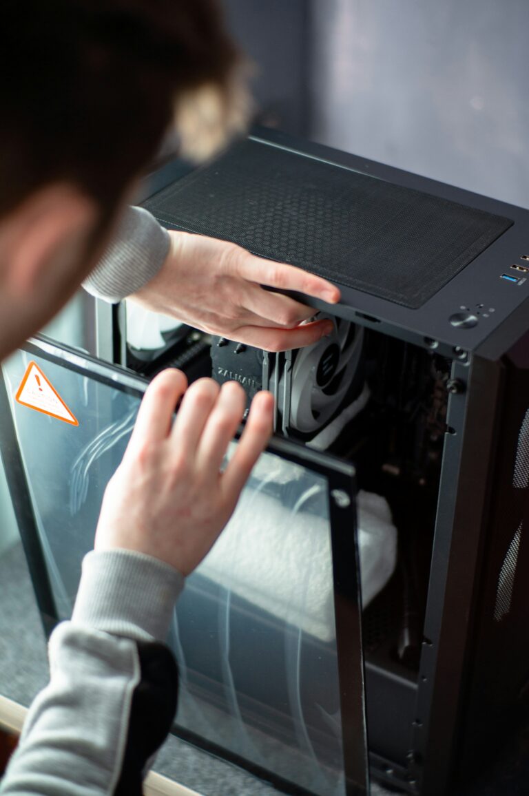 Technician installing computer hardware components